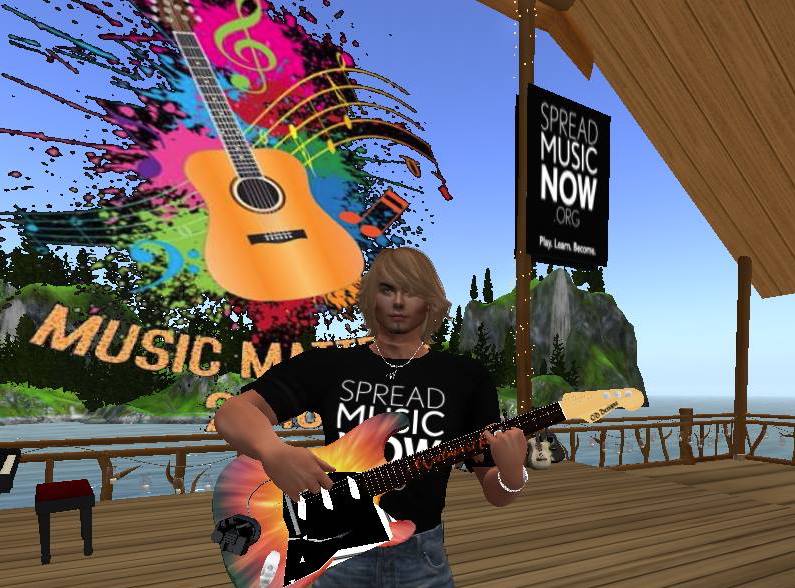 Blond man playing guitar